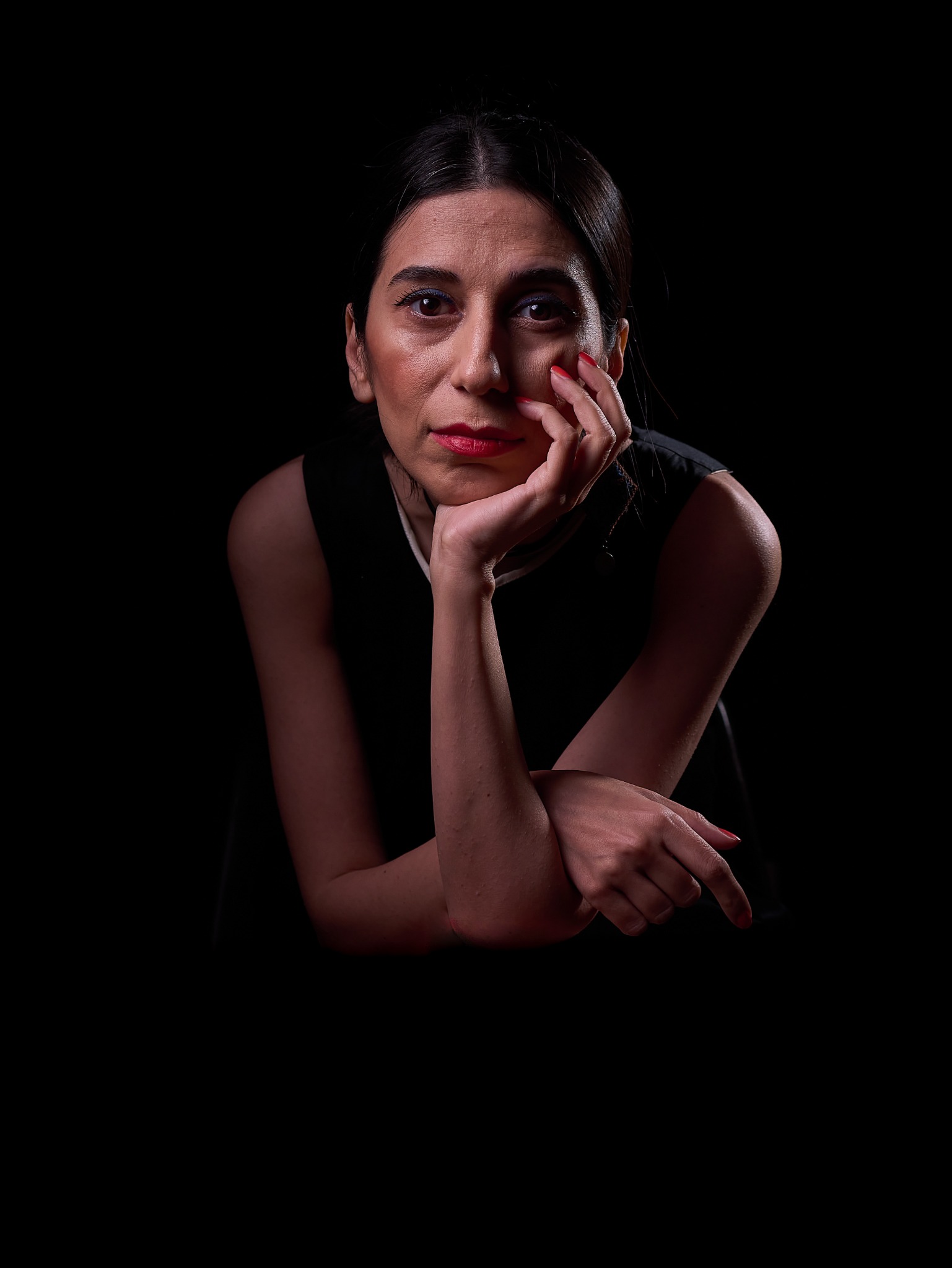 Low-key portrait of multidisciplinary artist Esha Sadr
