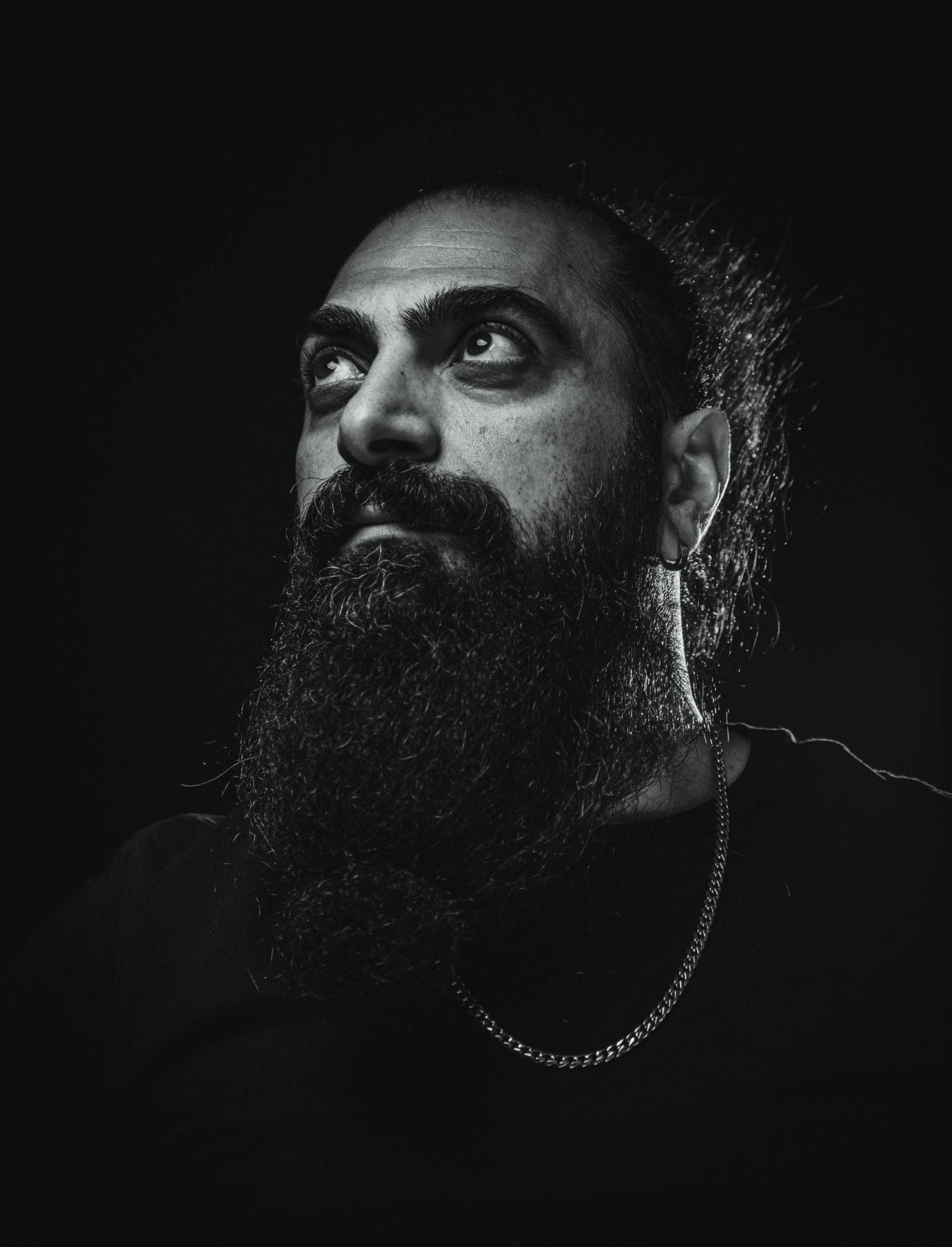 Black-and-white portrait of conceptual artist Ramin Etemadi-Bozorg